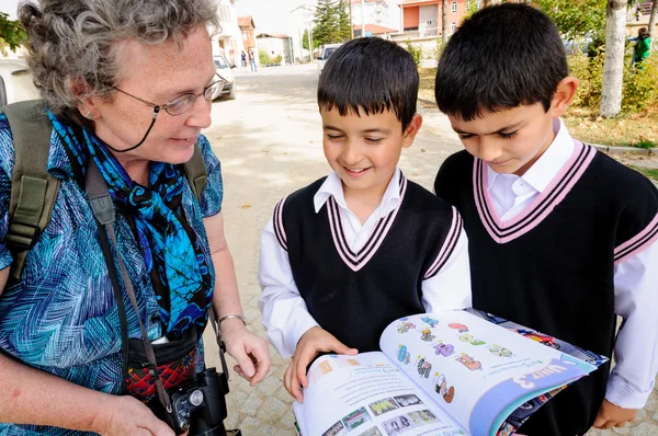 Two schoolboys practice their English