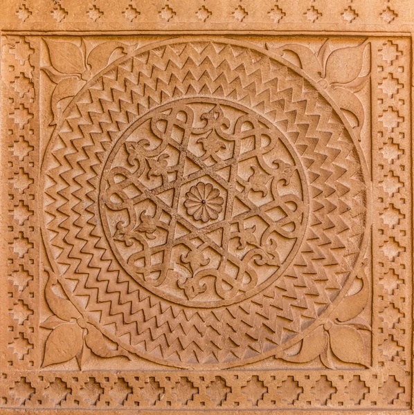 Carved sandstone plaque — Stock Photo, Image