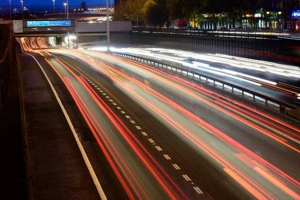 Streaks of coloured light from vehicles — Stock Photo, Image