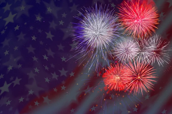 Celebration fireworks over American flag background.Veterans Day fireworks.
