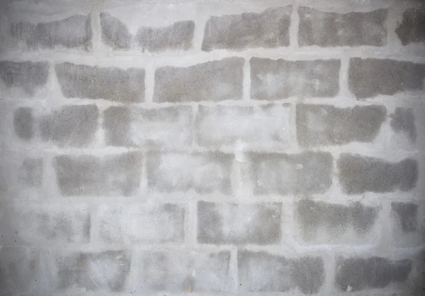 Tijolo cinza é Aparecer da parede de cimento, textura — Fotografia de Stock