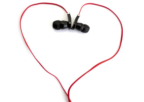 Red earphone setting in heart shape on white background — Stock Photo, Image