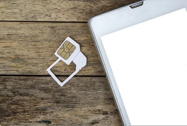 Uso de telefone inteligente com cartão micro sim por adaptador e cartão SIM normal, tela branca Imagem De Stock