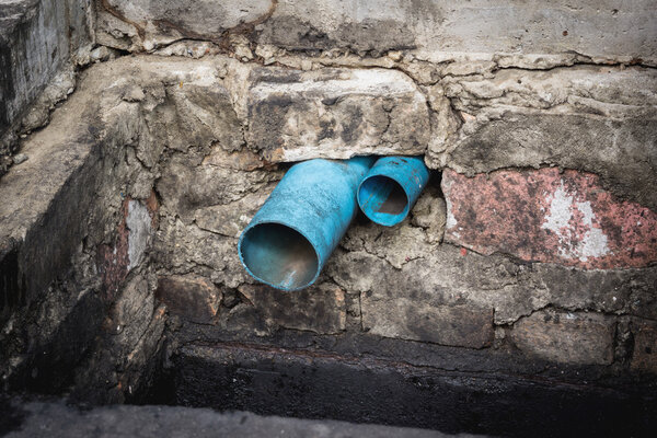 Water pipe in dirty sewer