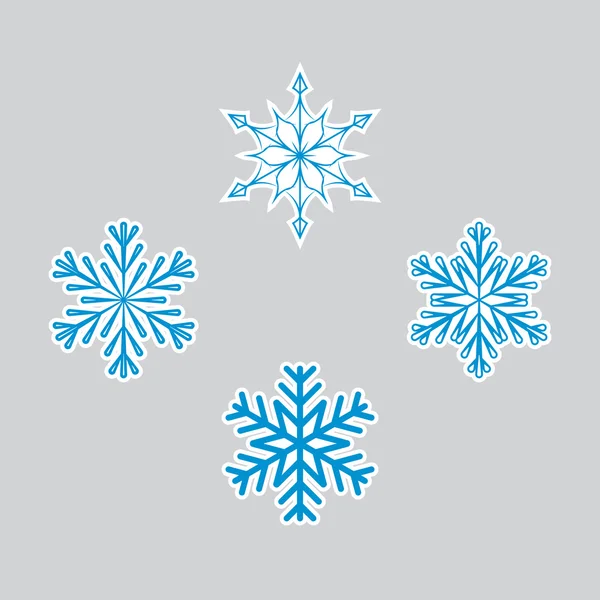 Schneeflockensymbole für den Winter — Stockvektor