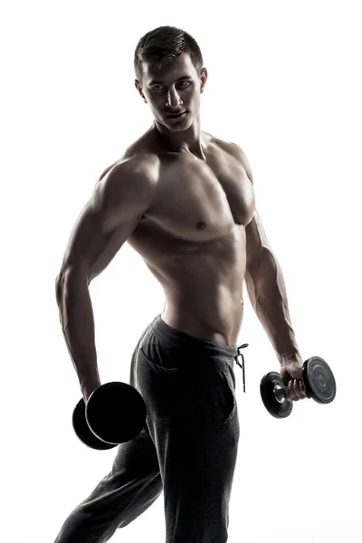 Muscular man showing perfect body with dumbbells, isolated on white — Φωτογραφία Αρχείου