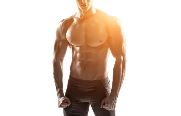 Hombre fuerte mostrando abdominales perfectos, rocas, bíceps, tríceps y pecho —  Fotos de Stock