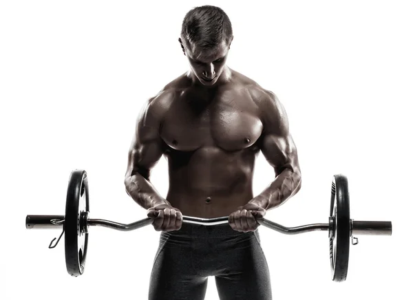Young handsome man with naked torso and barbell — Stok fotoğraf