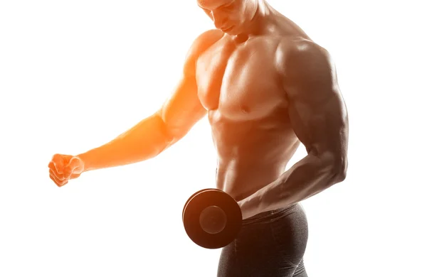 Athletic man showing muscular body and doing exercises with dumbbells — Zdjęcie stockowe