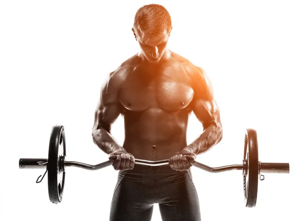 Young handsome man with naked torso and barbell — ストック写真