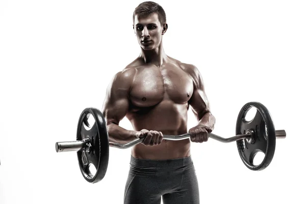 Young handsome man with naked torso and barbell — Stok fotoğraf