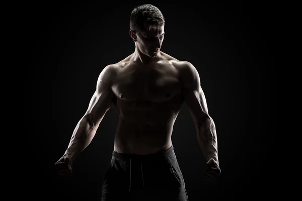 性感肌肉男和裸体躯干在黑色背景上的合影 — 图库照片