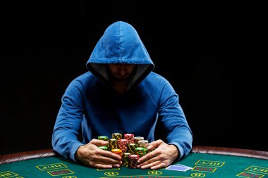 Poker player taking poker chips after winning clipart