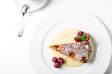 Piece of delicious clafoutis with nectarine and plum
