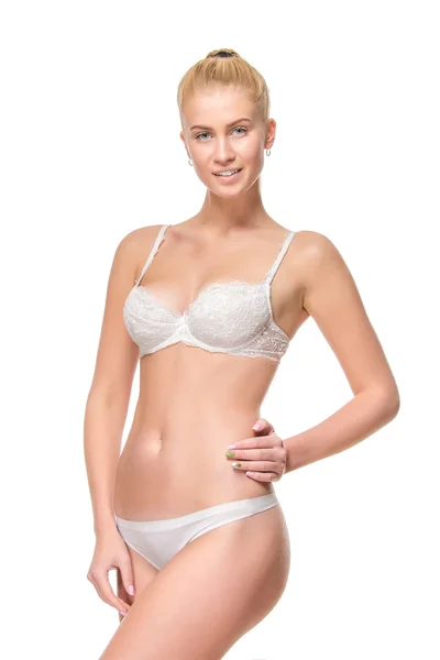 Unga blonda kvinnan i vita underkläder, studio — Stockfoto
