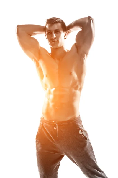 Muscular man posing, flexing his biceps, showing perfect body. — 图库照片