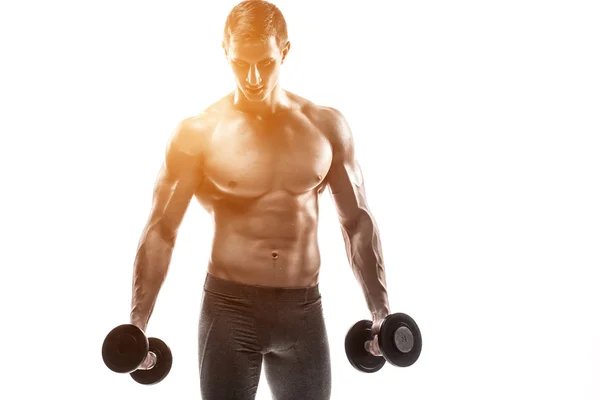 Muscular man showing perfect body with dumbbells, isolated on white — Φωτογραφία Αρχείου