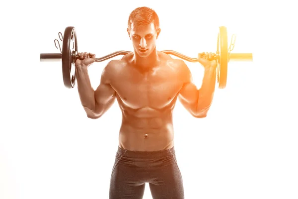 Strong man exercising fitness body building exercises with a barbell — Stok fotoğraf