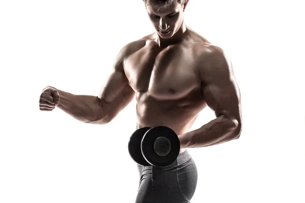 Athletic man showing muscular body and doing exercises with dumbbells — ストック写真