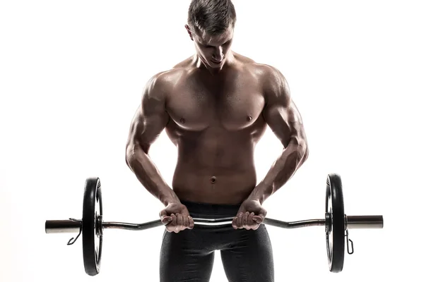 Young handsome man with naked torso and barbell — Stok fotoğraf