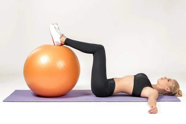 Young woman training with fitball — Stock Photo, Image