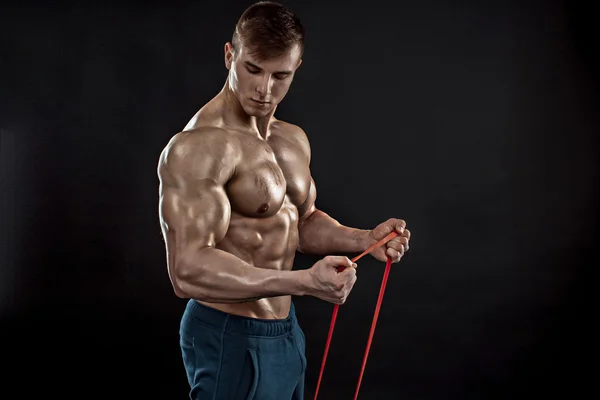 Hombre atlético joven haciendo ejercicio —  Fotos de Stock