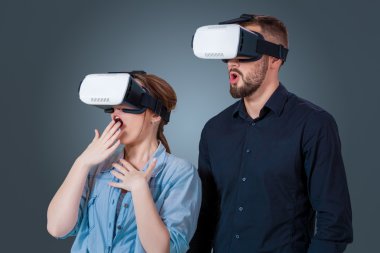 young couple using a VR headset glasses