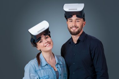 young couple using a VR headset glasses