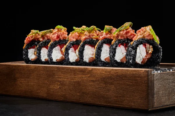 California black roll with eel, salmon, shrimp and tobiko — Stok fotoğraf