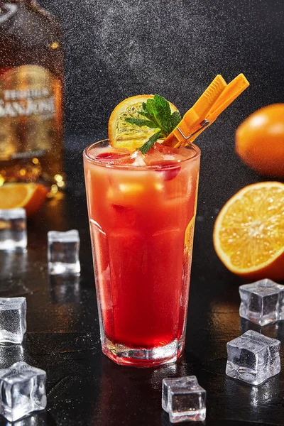 Cocktail tequila sunrise with grenadine syrup, orange juice, tequila