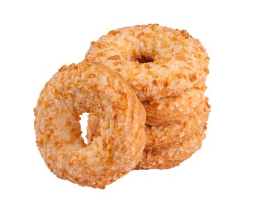 Beyaz üzerinde şeker ve fıstık kırıntıları olan karamelli halkalar.