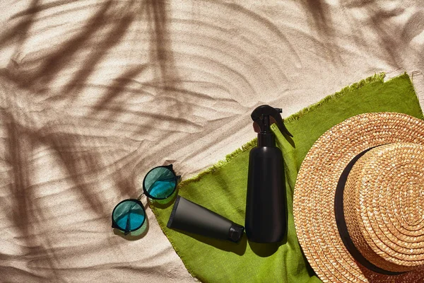 Traveler vacation accessories are laid out on a white beach sand. Flat lay, top view. — Stock Photo, Image