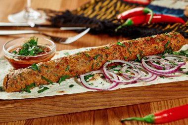 Lamb kebab with thin lavash, fresh onion and satsebeli sauce