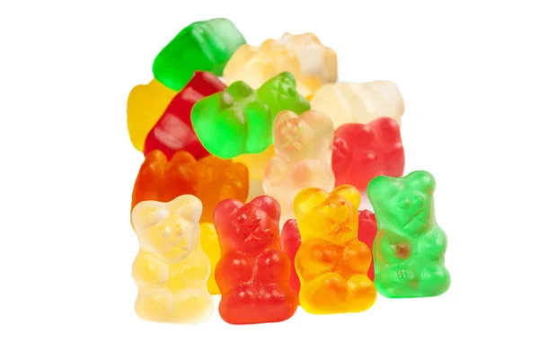 Pile di orsi gelatina vivacemente colorati isolati su sfondo bianco — Foto Stock