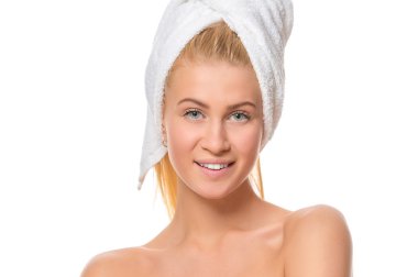 Young attractive blond woman with blue eyes in a towel