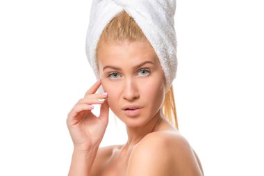 Young attractive blond woman with blue eyes in a towel