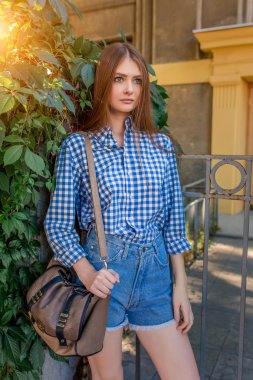 Portrait of a beautiful young woman on the streets city