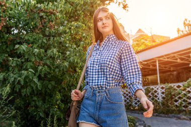 Portrait of a beautiful young woman on the streets city