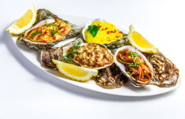 Dish with baked oyster shell cheese, salad oysters, served green clipart