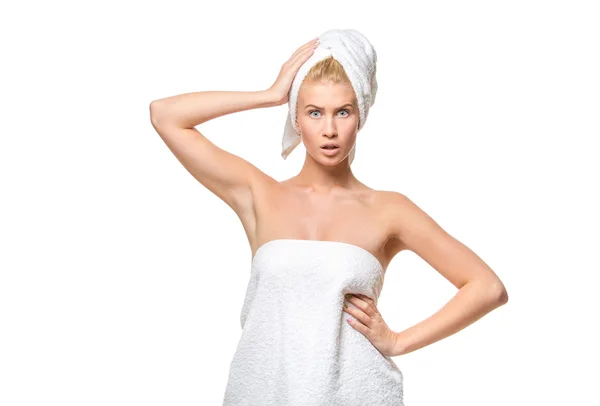 Young attractive woman with blue eyes in a towel — Stockfoto