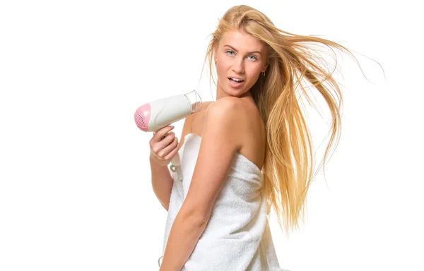 Young blond woman with blue eyes in towel dries hair — 스톡 사진