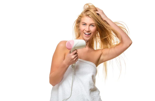 Young blond woman with blue eyes in towel dries hair — Stock Photo, Image