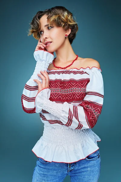 Portrait of charming young lady with short hair in embroide — Stock Photo, Image
