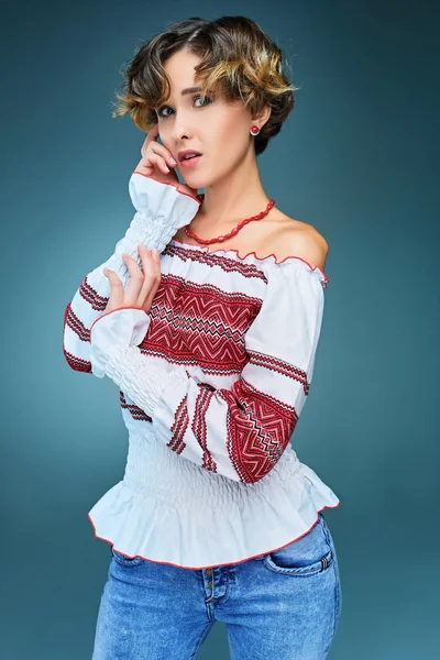 Portrait of charming young lady with short hair in embroide — 스톡 사진