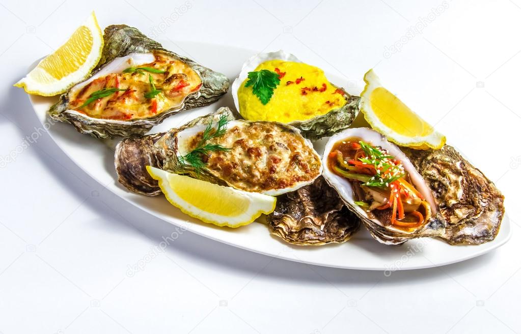 Dish with baked oyster shell cheese, salad oysters, served green