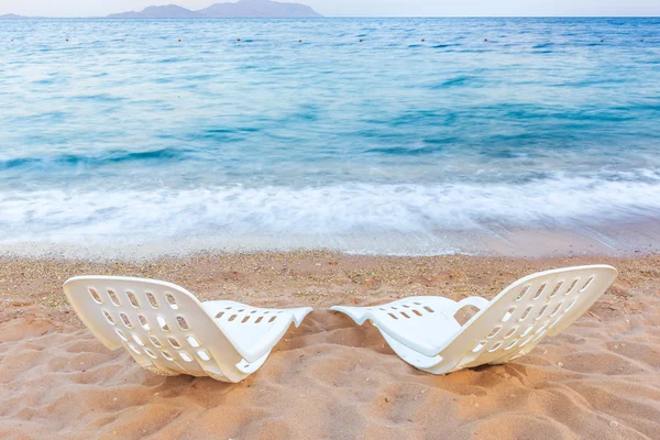 Landscape of Two Lonely beachchairs on the sand near sea — ストック写真