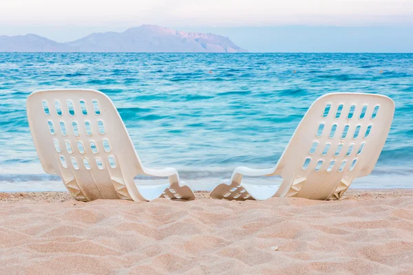 Landscape of Two Lonely beachchairs on the sand near sea — ストック写真