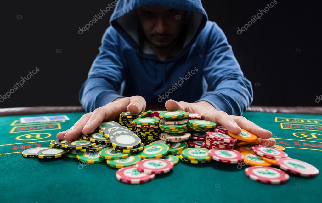 Poker player going all-in pushing his chips forward Stock Photo by  ©nazarov.dnepr@gmail.com 96884740