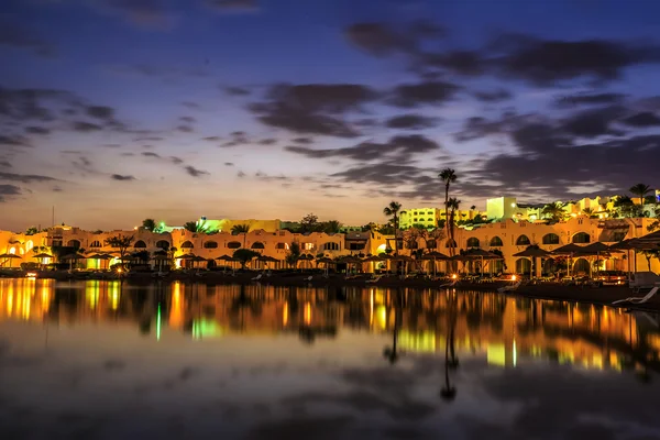 Evening view from sea for luxury hotel in night illumination — Stock Photo, Image