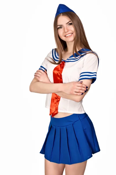 Girl in costume sailors. The blue skirt, white shirt, red tie, forage cap. Photo on a white background. Stock Picture